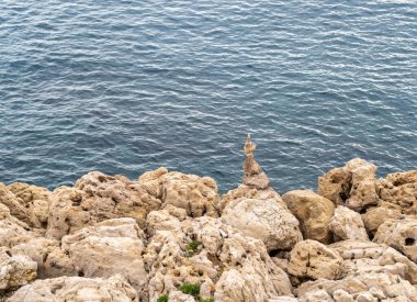 Stone pyramid. Pebbles balance pile, harmony zen stones, balance stack, sea pebble pyramid on shoreline, relaxation and peace concept