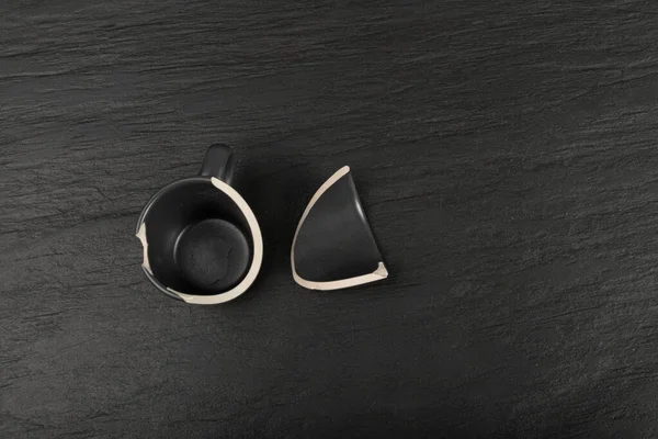 Broken Mug Black Ceramic Cup Pieces Smashed Teacup Careless Concept — Foto Stock