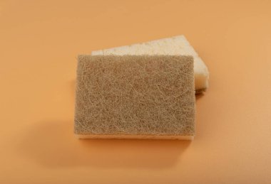 Natural Sponge, Eco Brown Sponges, Eco Friendly Hygiene Accessory, Scotch Brite Dishwasher on Yellow Background