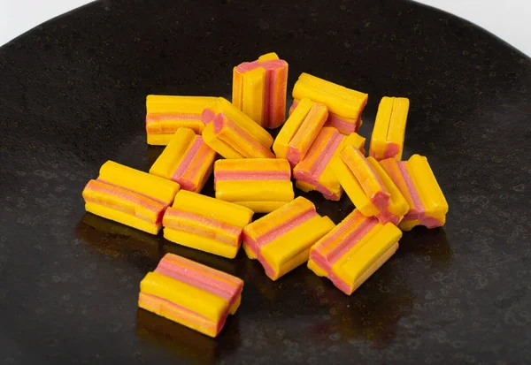 Chewing Gum Cubes Pile on Black Plate, Fruit Color Bubble Gum Set, Sweet Pink Bubblegum Closeup