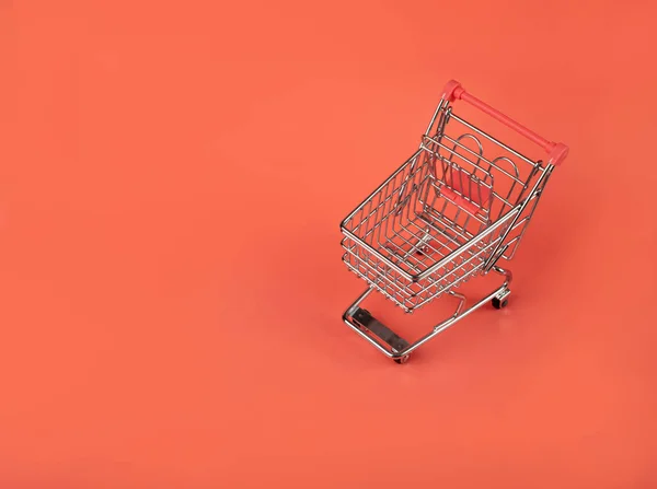 Shopping Basket on Red Background, Shopping Cart, Shop Cart Mockup, Empty Trolley, Supermarket Cart with Copy Space