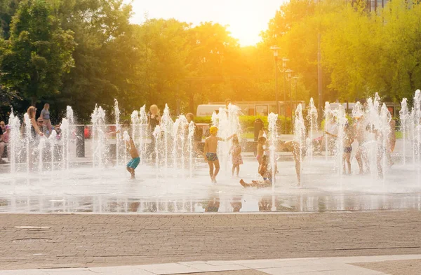 Kids in Fountain Water, Children in Waterfall Splash, Hot in City Concept, Fountain Water, Blurred Background