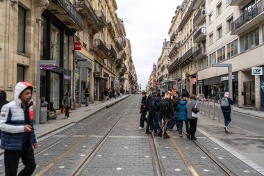 Bordeaux, France, April 17, 2024: The old city center of Bordeaux after rain, old streets, historical buildings in France, editorial image clipart