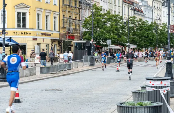 stock image Warsaw, Poland, June 9, 2024: Ironman triathlon, iron man long-distance triathlon races in old Warsaw city center, editorial image