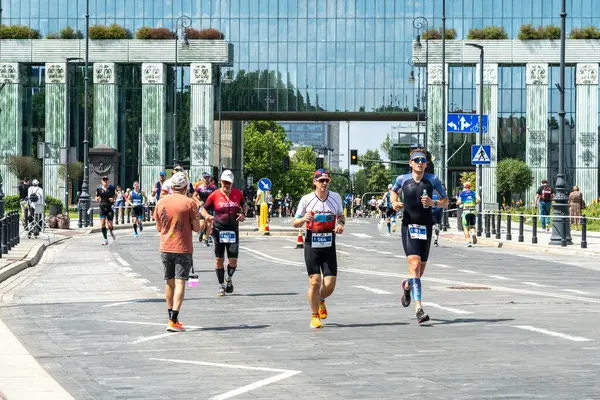 stock image Warsaw, Poland, June 9, 2024: Ironman triathlon, iron man long-distance triathlon races in old Warsaw city center, editorial image