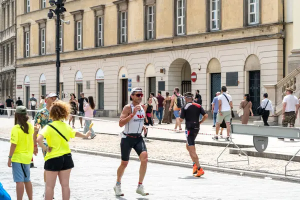 stock image Warsaw, Poland, June 9, 2024: Ironman triathlon, iron man long-distance triathlon races in old Warsaw city center, editorial image