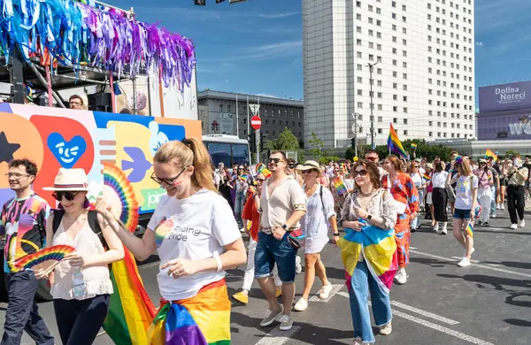 stock image Warsaw, Poland, June 15, 2024: Lgbtq pride parade, lgbt rainbow flags, colorful carnival crowd, gay tolerance festival, freedom and love symbol, happy fun atmosphere, editorial image