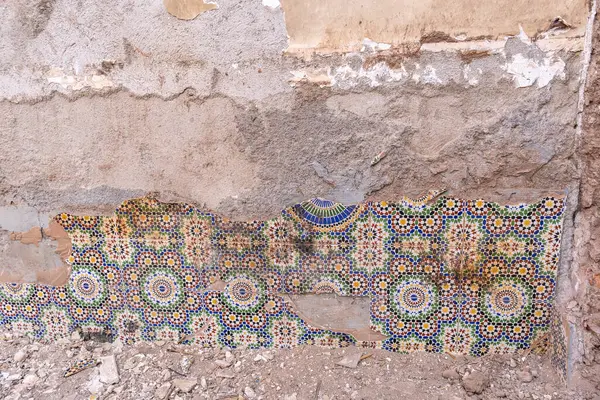 stock image Marrakech, Morocco, January 10, 2024: Narrow Marrakech streets, old town weathered walls, authentic, historical Morocco. Aged buildings in warm earthy tones, rustic charm, editorial image