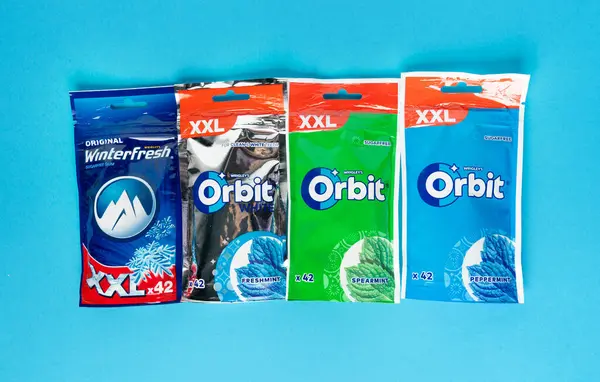 stock image Warsaw, Poland, July 1, 2024: Chewing gum Orbit by Wrigley, teeth hygiene spearmint sugar free gums, mint gum pads, white menthol bubblegum packaging, blue background, editorial image