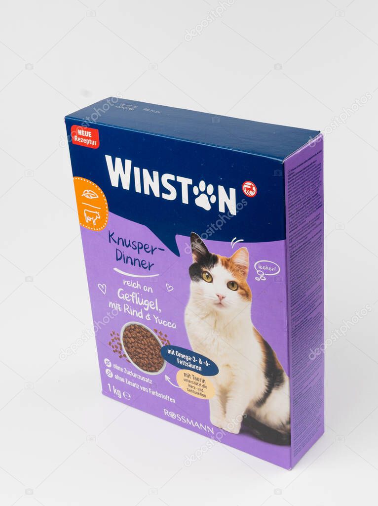 Warsaw, Poland, March 3, 2025: Winston cat food pack with dry pet food, kibble by Rossmann, animal food granules on white background, editorial image