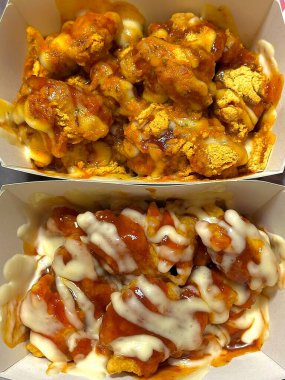 Kızarmış Kore tavuğu, tatlı ve baharatlı sosla mükemmel bir şekilde jölelenmiş. Yemek fotoğrafçılığı ve menüler için idealdir. Bu sevilen yemeğin dayanılmaz çıtırtısını ve lezzetini sergiler..