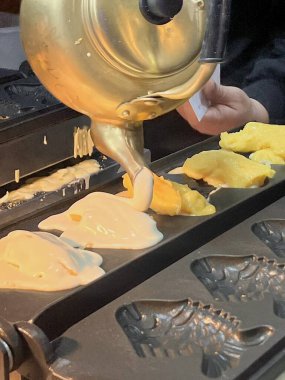 Bungeoppang, bungeo-ppang Kore balık şekilli hamur işi, popüler atıştırmalıklar, kurabiyeler, Kore 'nin kışlık sokaklarında tatlı. Bungeoppang. Geleneksel Kore yemeği, yemek, mutfak. Japon Taiyaki.