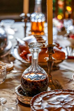 Elegant Table Setting Featuring a Crystal Decanter with Molasses clipart