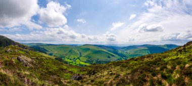 Breathtaking View of Minffordd and the Countryside South-East Toward Aberllefenni and Nearby Woodlands from Near Penygader (Cadair Idris) Summit clipart