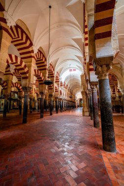 Great Mosque of Crdoba from the 8th Century featuring Moorish Arches Umayyad Legacy and a 13th Century Christian Conversion in Spains Andalusia clipart