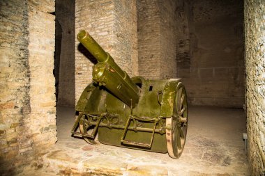 Timeworn Field Cannon in Gjirokaster Castles Mysterious Stone Chambers: Albanias Historic Artillery Display in an Ottoman-Era UNESCO Fortress