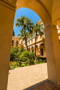 Arched View of the Jardine del Principe in Sevilles Royal Alcazar: A 16th-Century Spanish Renaissance Courtyard of Post-Moorish Splendor & Regal Grace