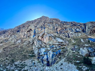 Rocky mountain cliff unique texture cobalt sky ariege Artigue Auzat clipart