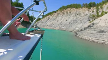 calm scene anchoring lake turquoise waters Serre-Poncon rugged shores