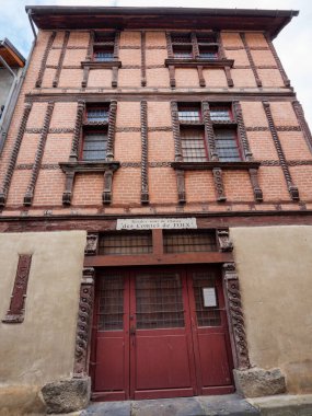 Faade of the historic hunting lodge of the Counts of Foi, a medieval half-timbered brick building in Ariege French Pyrenees