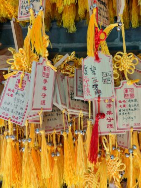 Wishing tablet. Wooden tablets with prayers at Chinese temple. clipart