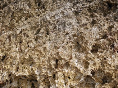 Dalgaların soyut taş dokusu aşınır, doğa arka planı.