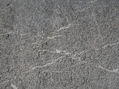 Gri taş ve beyaz gölgelerin dokusu veya arkaplanı