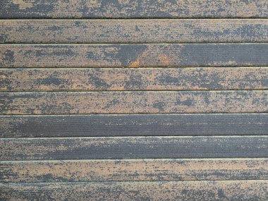 Eski ve paslı çinko çarşaf duvarının artistiği. Klasik stil metal yaprak çatı dokusu. Eski metal levha deseni. Paslı metal ya da yanlamasına. Galvanizasyon aşınması. Geçmiş kavramında arkaplan ve doku