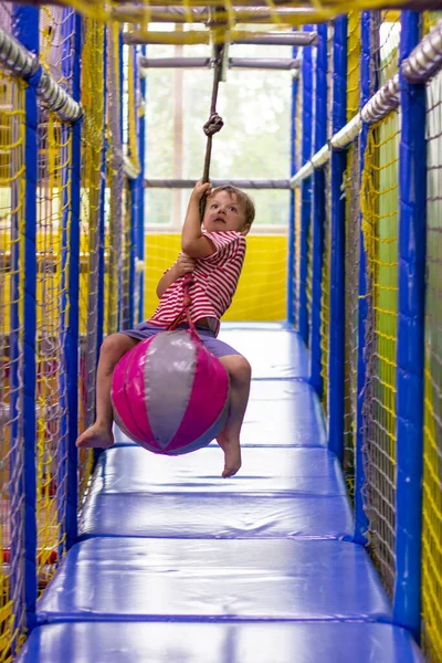 Boy Riding Hanging Ball Entertainment Center — Stock Photo, Image