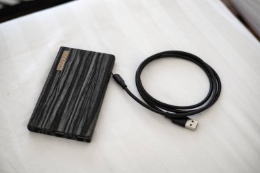 Power bank with charging cable ready to use.