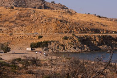 rocky desert landscape with a sea wild beach on a barren rocky foothills