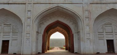 The archway is white and red. The archway is open and the inside is empty. The archway is a part of a building clipart