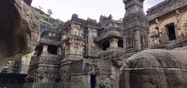 A large building with a lot of detailed carvings and a lot of windows. The building is old and has a lot of history. Kailasa Temple, Ellora Caves, India clipart