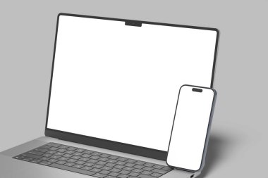 Masada boş ekran olan dizüstü bilgisayar ve akıllı telefon modeli, konsept modeli