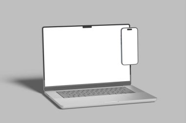 Masada boş ekran olan dizüstü bilgisayar ve akıllı telefon modeli, konsept modeli