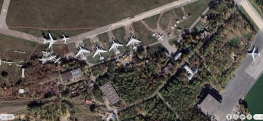 PC user zooms in using satellite images showing large heavy Russian military aircraft seen at airfields near Taganrog, Rostov Oblast, Russia.  clipart