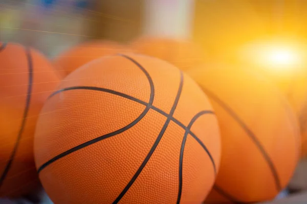 Many basketballs are placed in the gym for competition.