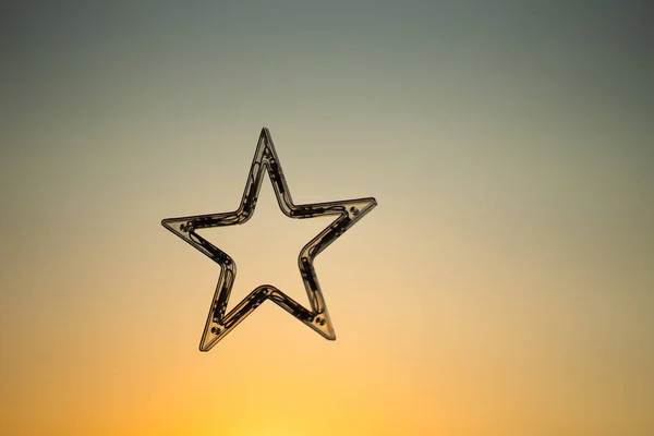 Single star object isolated on light color background.