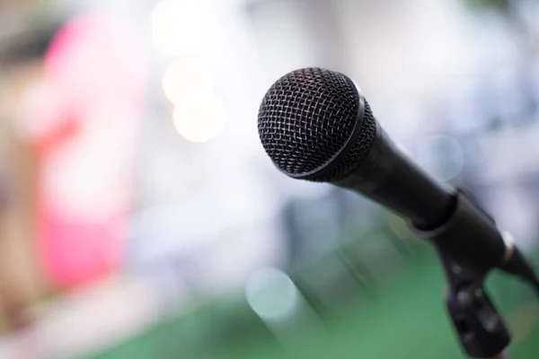 stock image microphone in seminar room or lighting in meeting room bokeh light background.