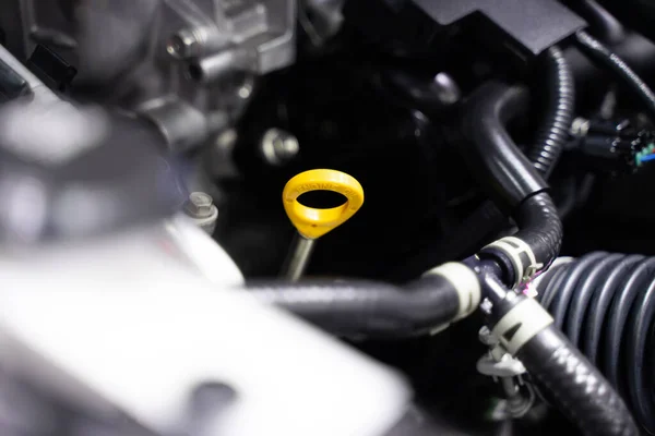 Close-up car oil check handle engine details effective Safe to travel