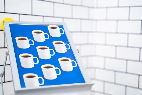 Banner with coffee cups for coffee shop decoration. Blurred background.