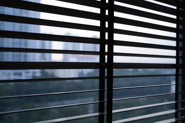 Roller blinds on modern windows Blinds on office windows Modern style roller blinds control the lighting range.