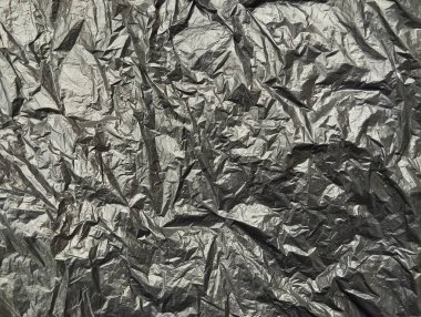 Buruşmuş siyah plastik torba dokusu ve arkaplanı 