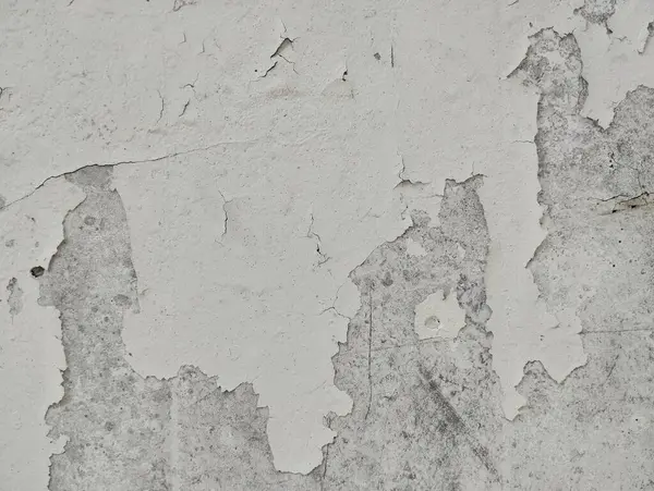 Eski, soyulmuş, eskimiş desen arka planlı, soyulmuş beyaz bir duvar.