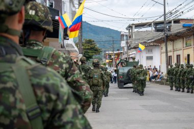 Colombian army near church, military forces next to religious building, Colombian soldiers patrolling near church, army troops in urban patrol near church, military presence by historic church clipart