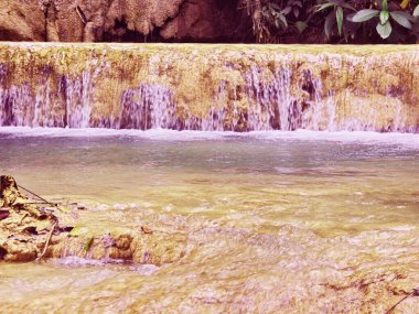 Tad Sae WaterfallsTad Sae Waterfall is a spectacular natural wonder you can enjoy during the wet season in Luang Prabang clipart