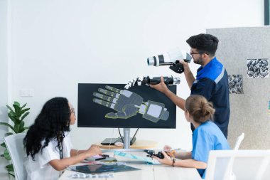 Engineers, doctors and physical therapists brainstorm ideas to design a robot with arm and hand organs, To be utilized for additional testing on patients. clipart