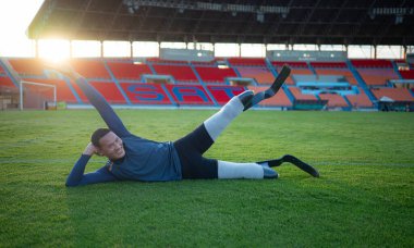 Athletes with disabilities take a break at the stadium between training sessions. clipart