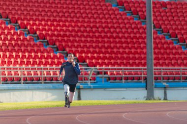 Athletes with disabilities who utilize running blades for short distances. Run down the running track. clipart