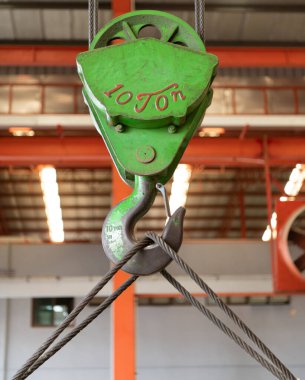 Metal hooks for heavy industrial lifting applications. For lifting or moving large or heavy objects clipart